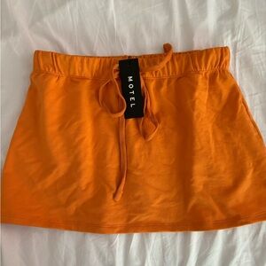 MOTEL DHECA MINI SKIRT IN ORANGE